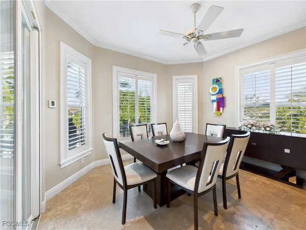 a view of a dining room with furniture and window