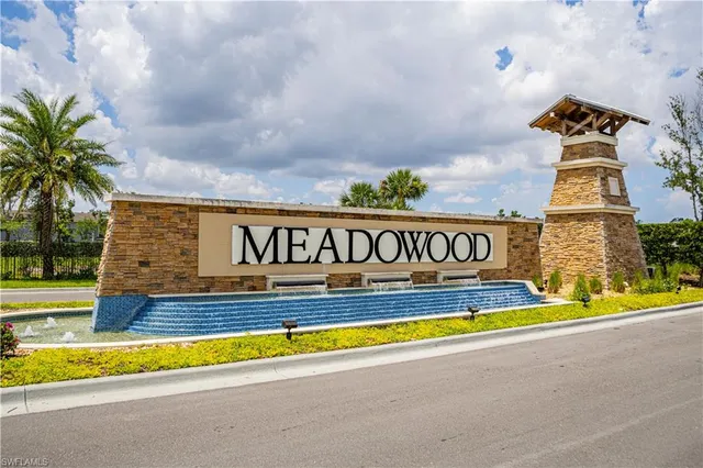 a view of swimming pool with outdoor seating and yard