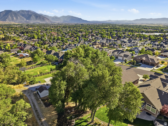 441 South 2080th Street East Springville, UT 84663 - Photo 53 of 64 Expansive residential area featuring numerous homes with varied architecture, mature trees, and mountainous terrain in the background