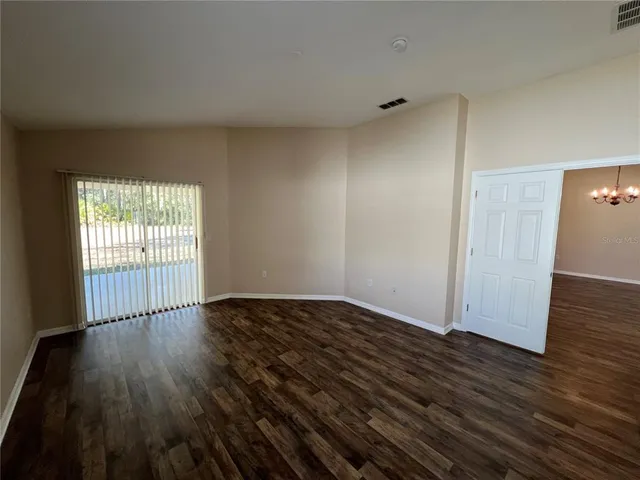 a spacious bathroom with a tub a sink and a large mirror