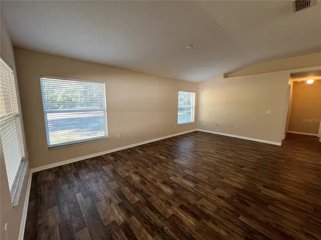 a view of kitchen with wooden floor
