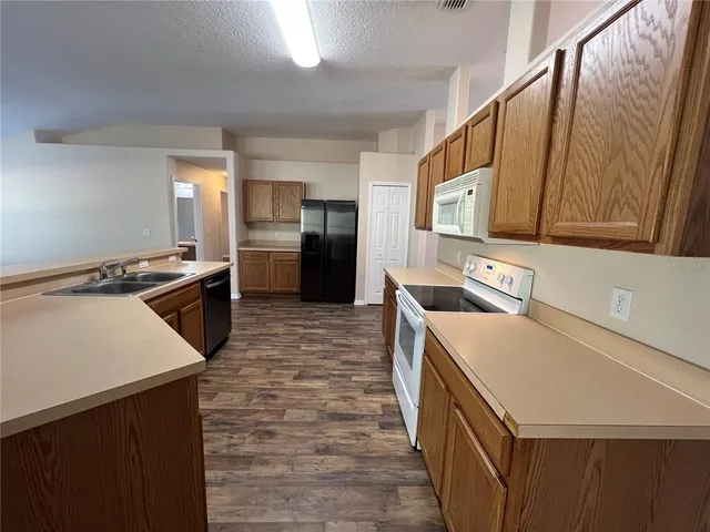 a bathroom with a sink toilet and a mirror
