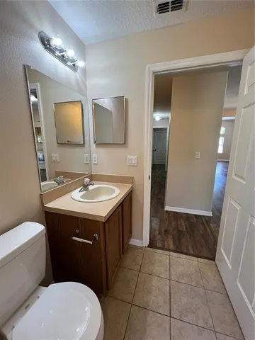a view of a room with wooden floor and closet