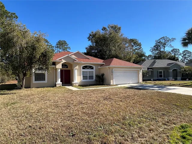 a view of a room with wooden floor and chandelier