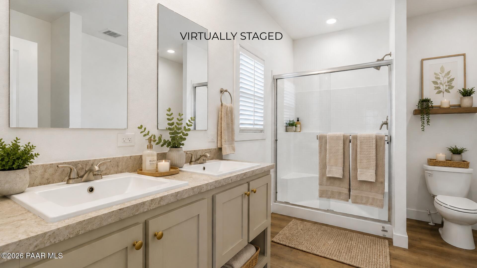 65 Hawaii Road Paulden, AZ 86334 - Photo 16 of 29 a bathroom with a double vanity sink toilet and shower
