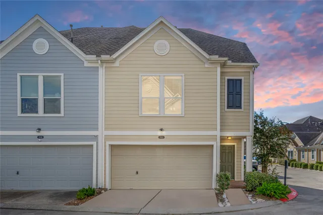 a front view of a house with a garage