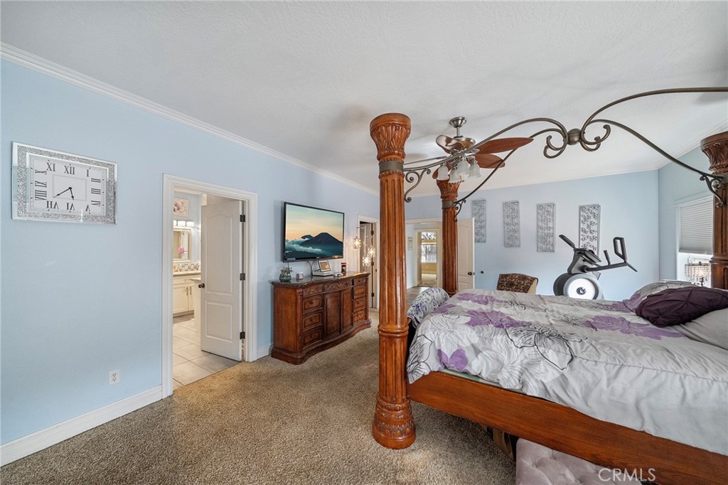 7172 Jargon Road Hesperia, CA 92344 - Photo 38 of 75 a bedroom with a bed and a mirror on the dresser