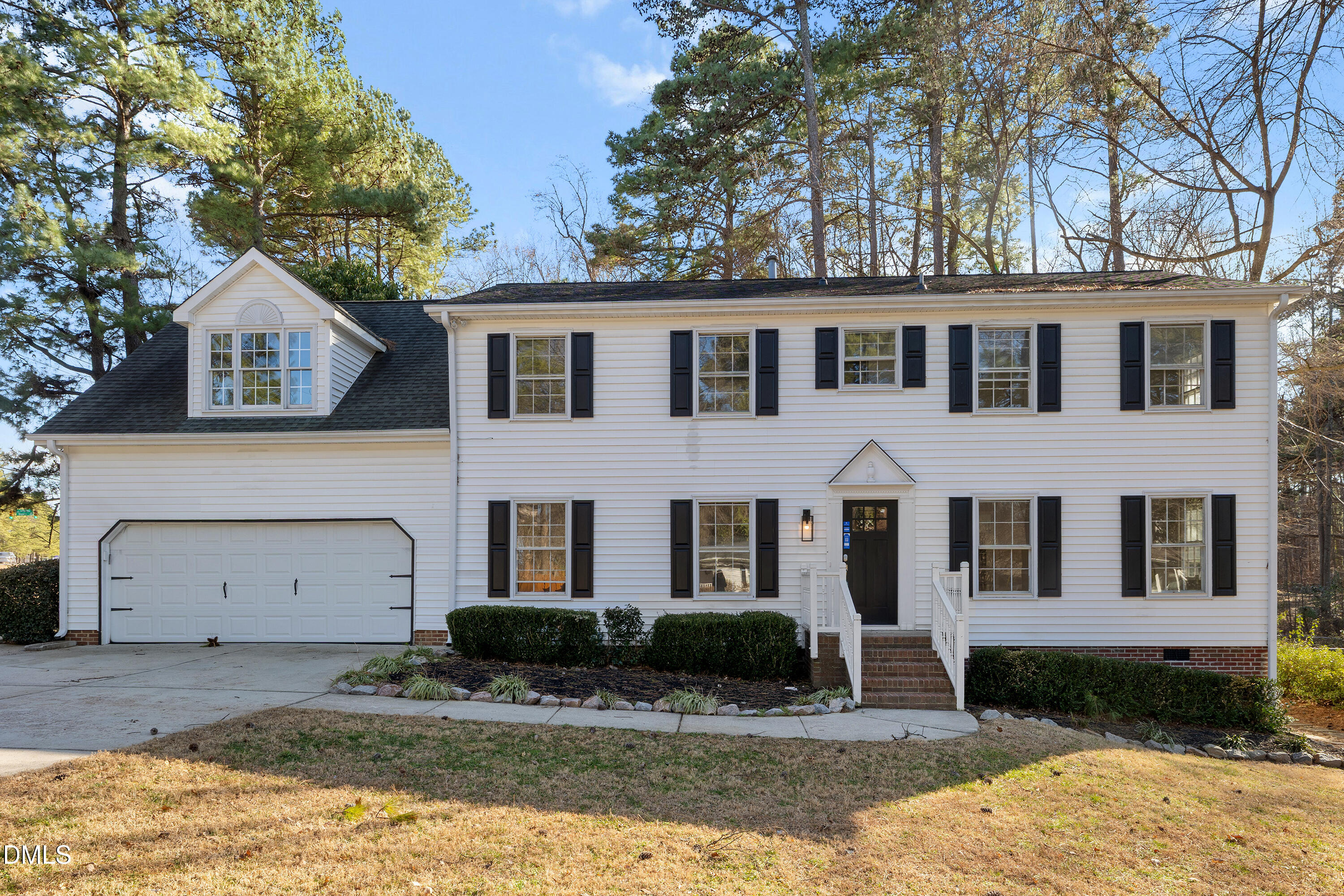 4601 Pemberton Drive Raleigh, NC 27609 - Photo 1 of 44 a front view of a house with a yard and garage