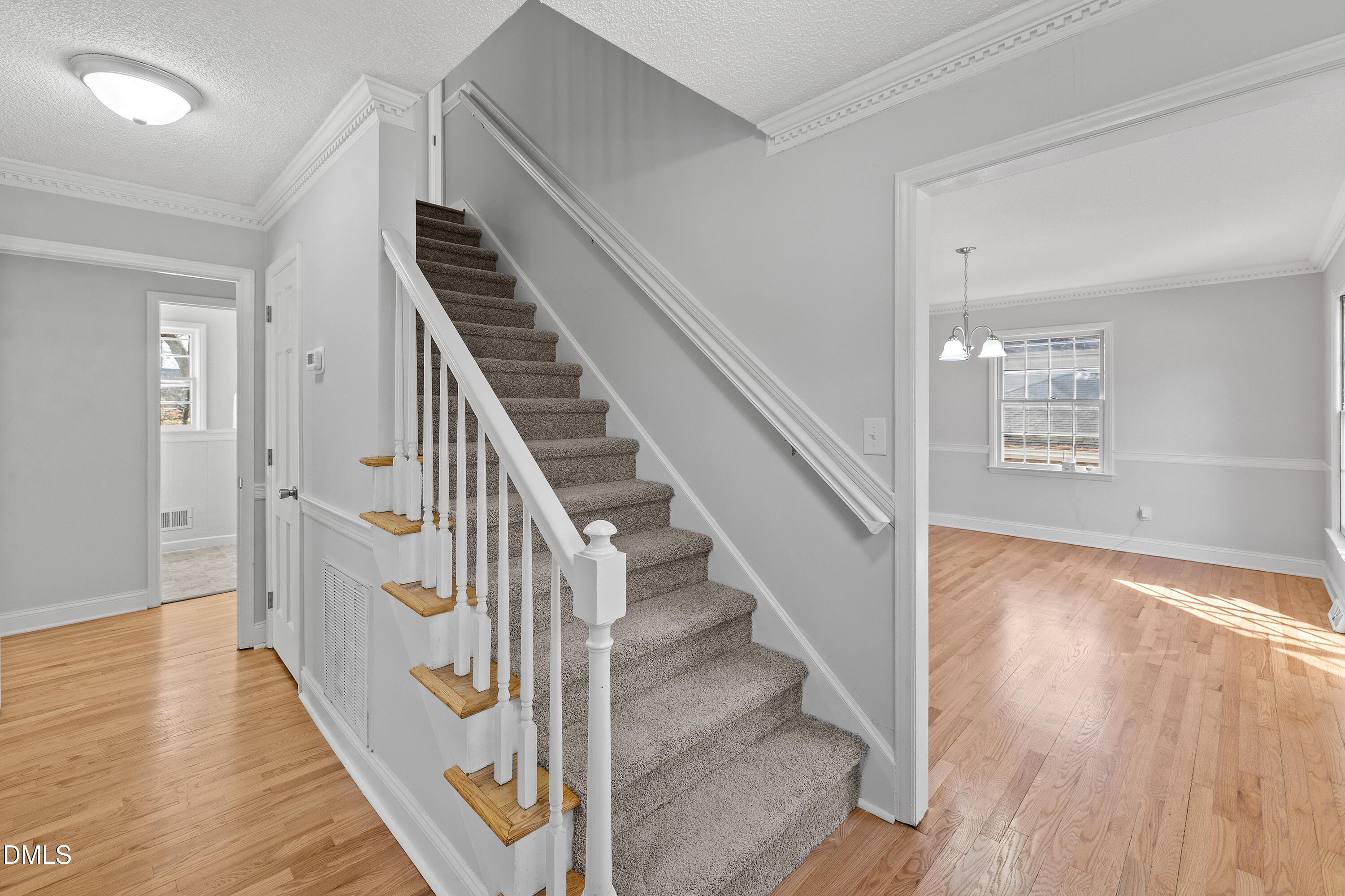4601 Pemberton Drive Raleigh, NC 27609 - Photo 9 of 44 a view of entryway with wooden floor