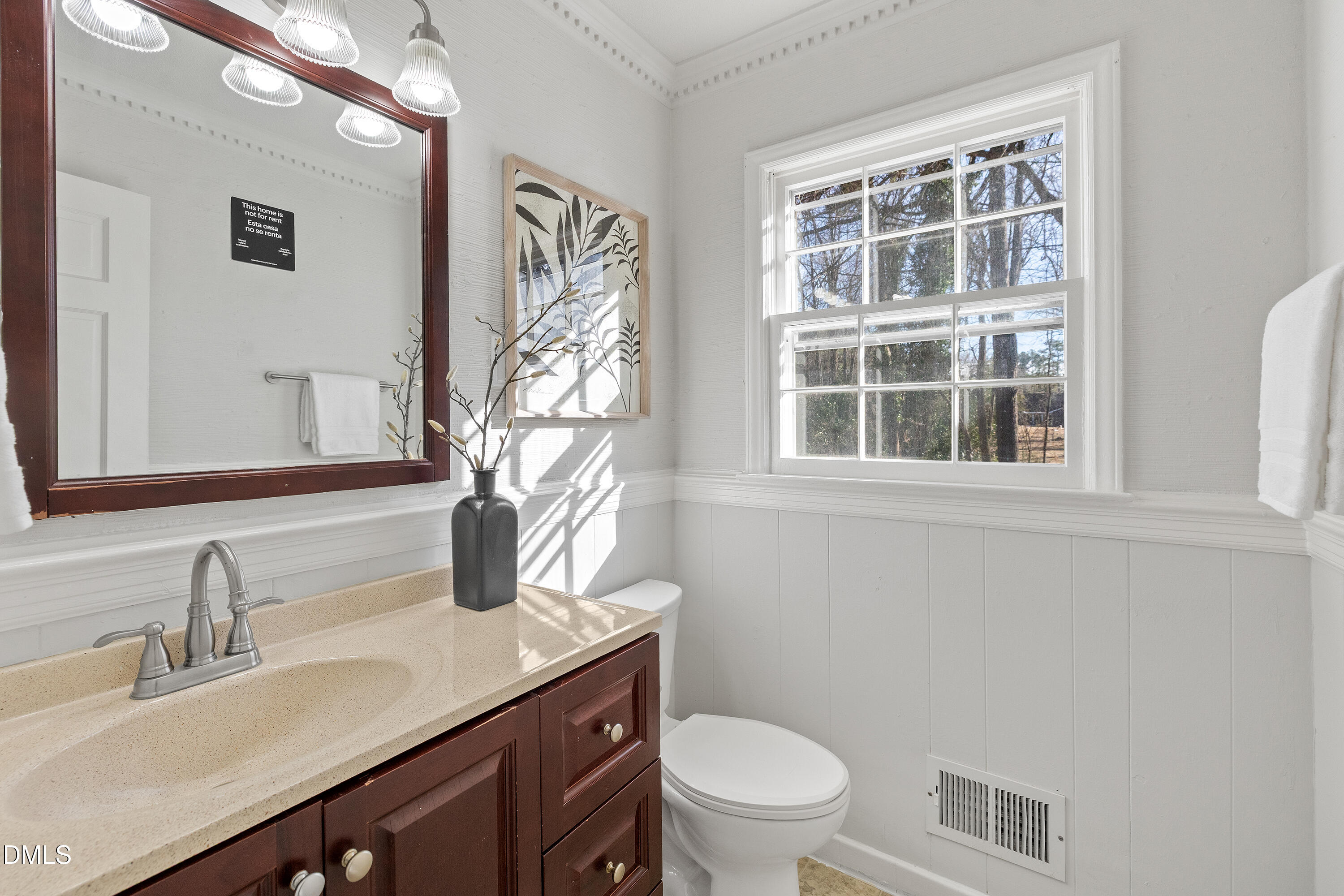 4601 Pemberton Drive Raleigh, NC 27609 - Photo 15 of 44 a bathroom with a granite countertop sink toilet and mirror
