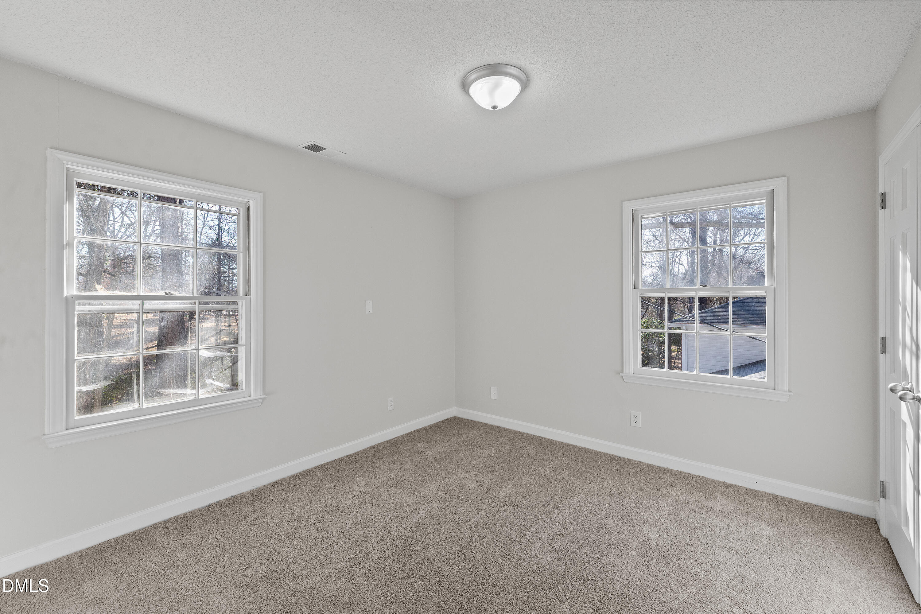 4601 Pemberton Drive Raleigh, NC 27609 - Photo 24 of 44 an empty room with a window