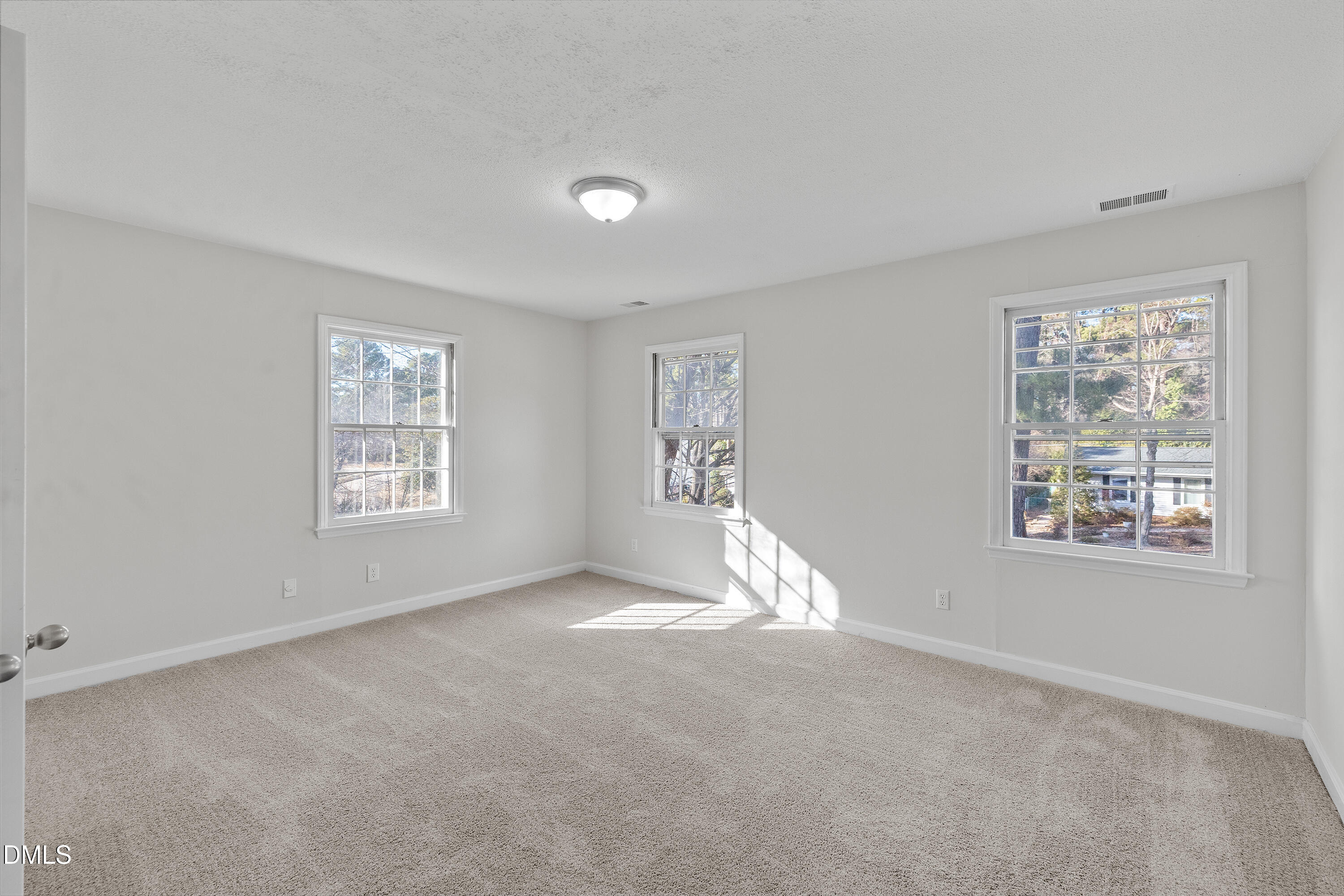 4601 Pemberton Drive Raleigh, NC 27609 - Photo 26 of 44 a view of empty room with windows