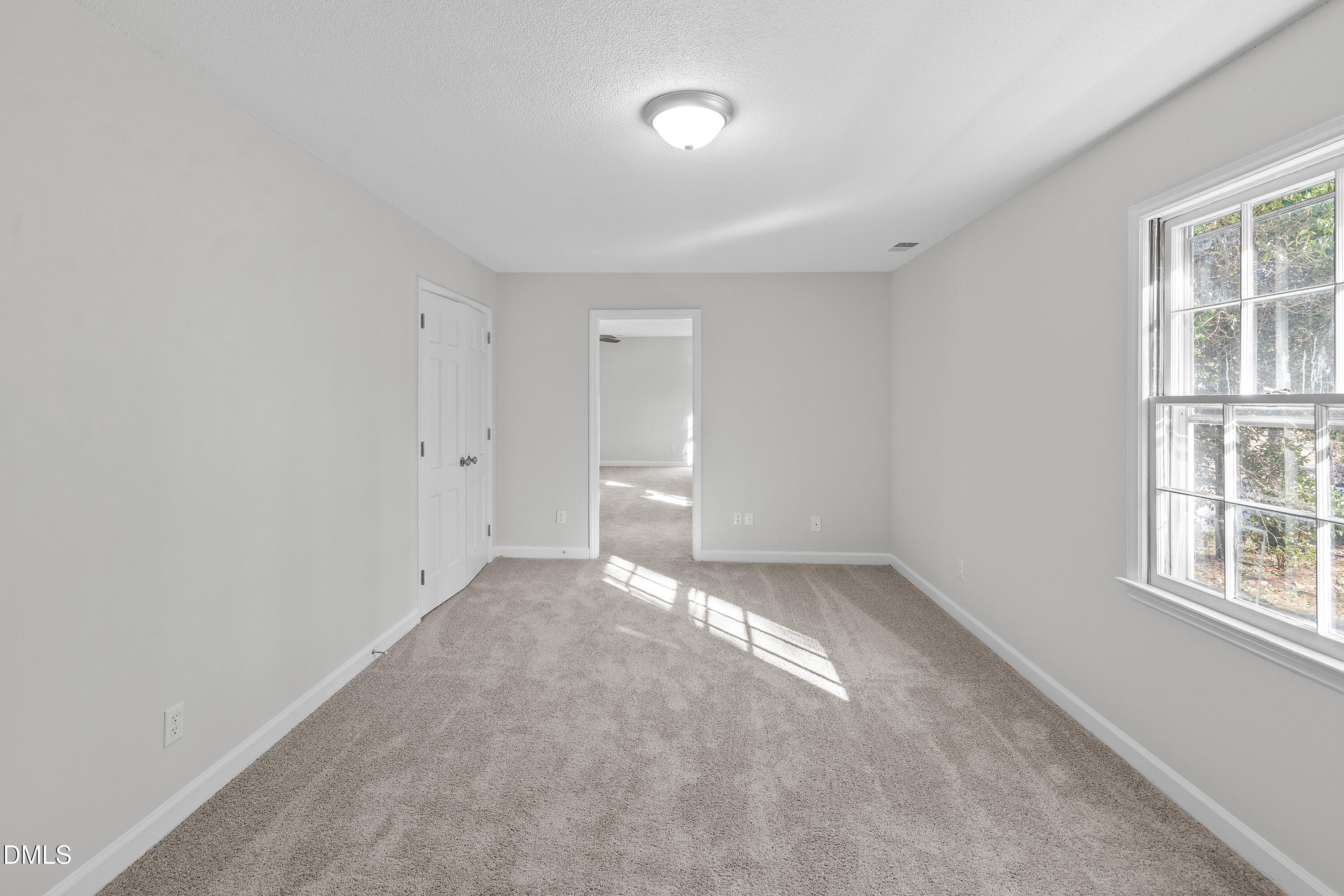 4601 Pemberton Drive Raleigh, NC 27609 - Photo 29 of 44 an empty room with windows and closet