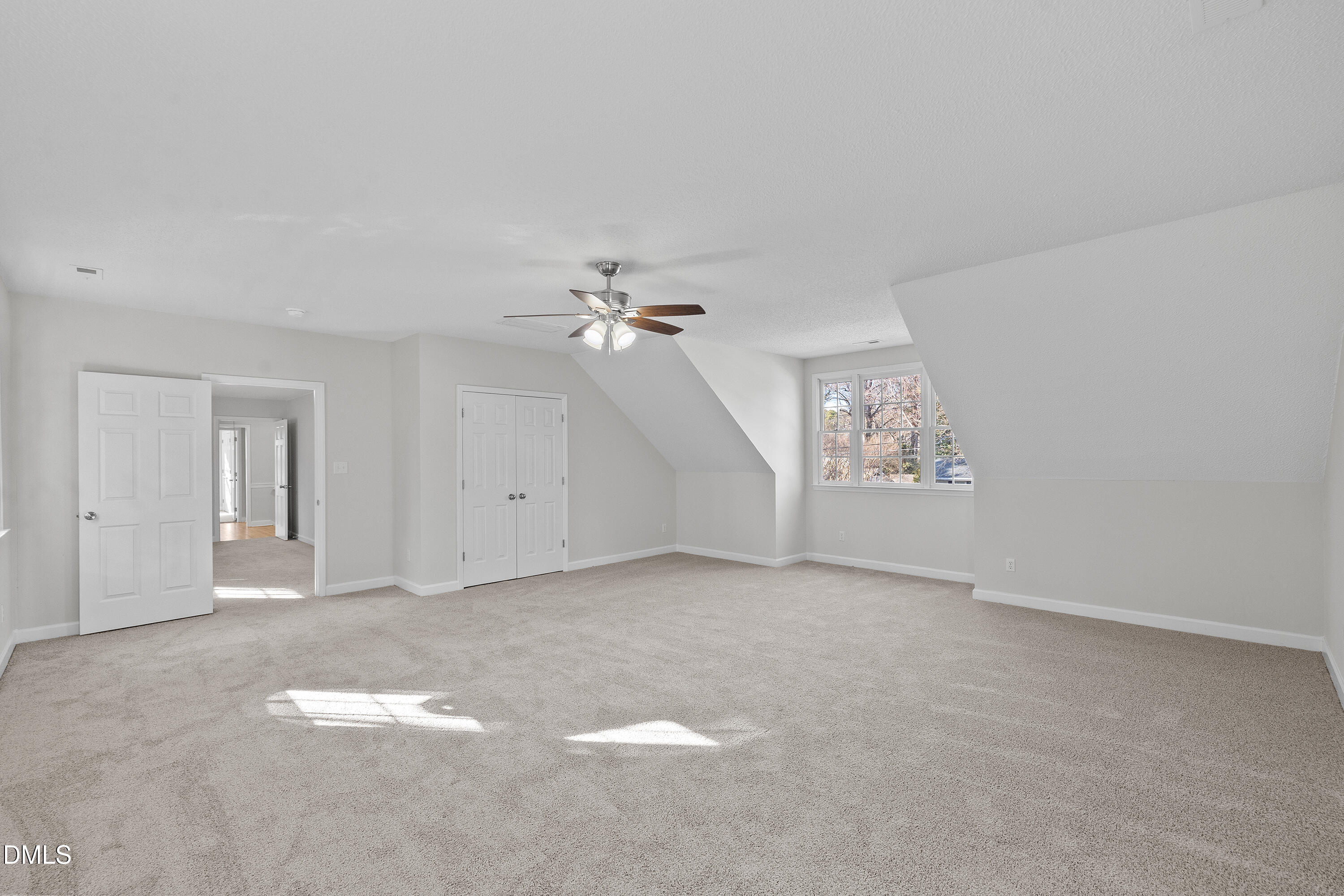 4601 Pemberton Drive Raleigh, NC 27609 - Photo 32 of 44 a view of an empty room with chandelier fan