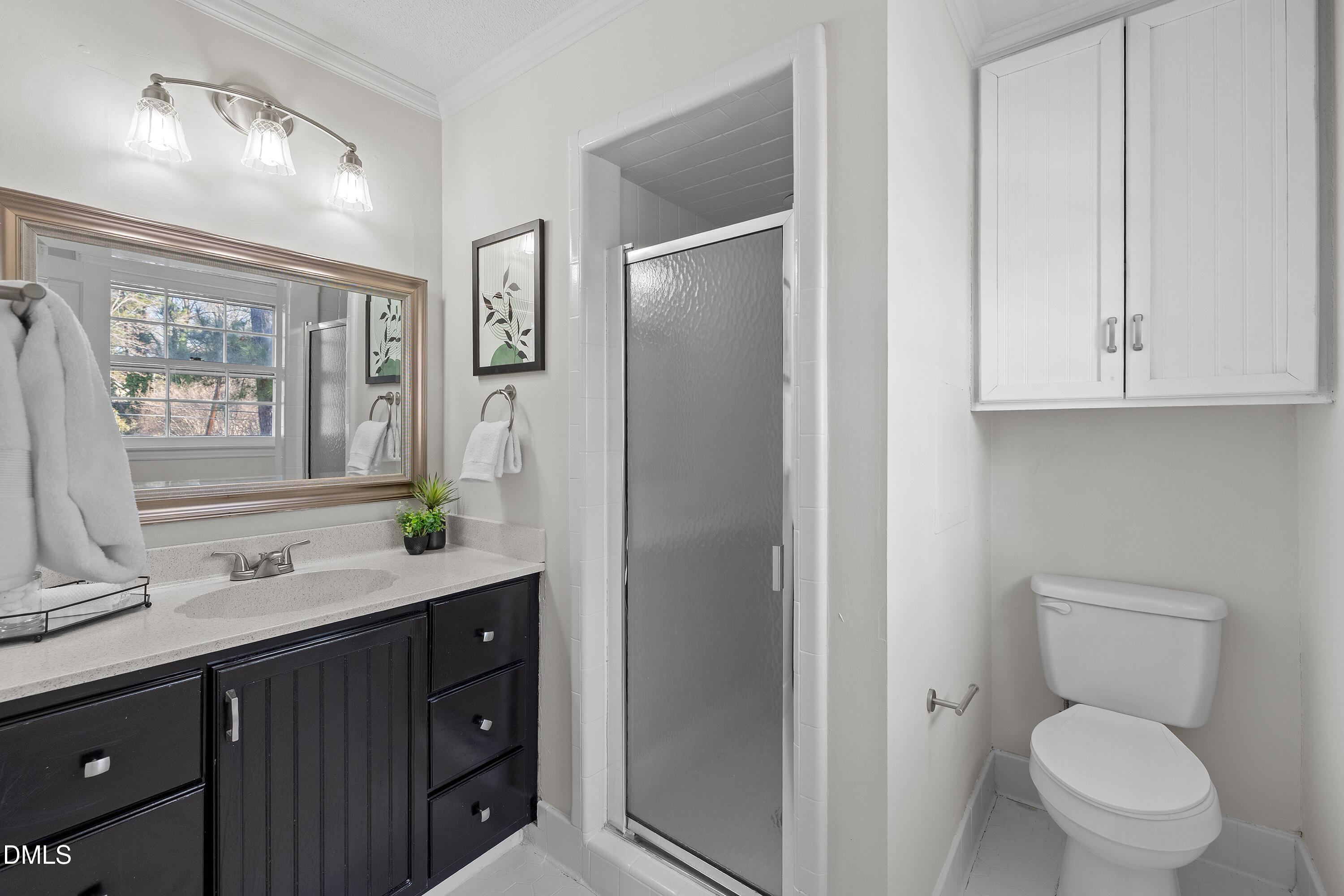 4601 Pemberton Drive Raleigh, NC 27609 - Photo 33 of 44 a bathroom with a granite countertop toilet sink and mirror