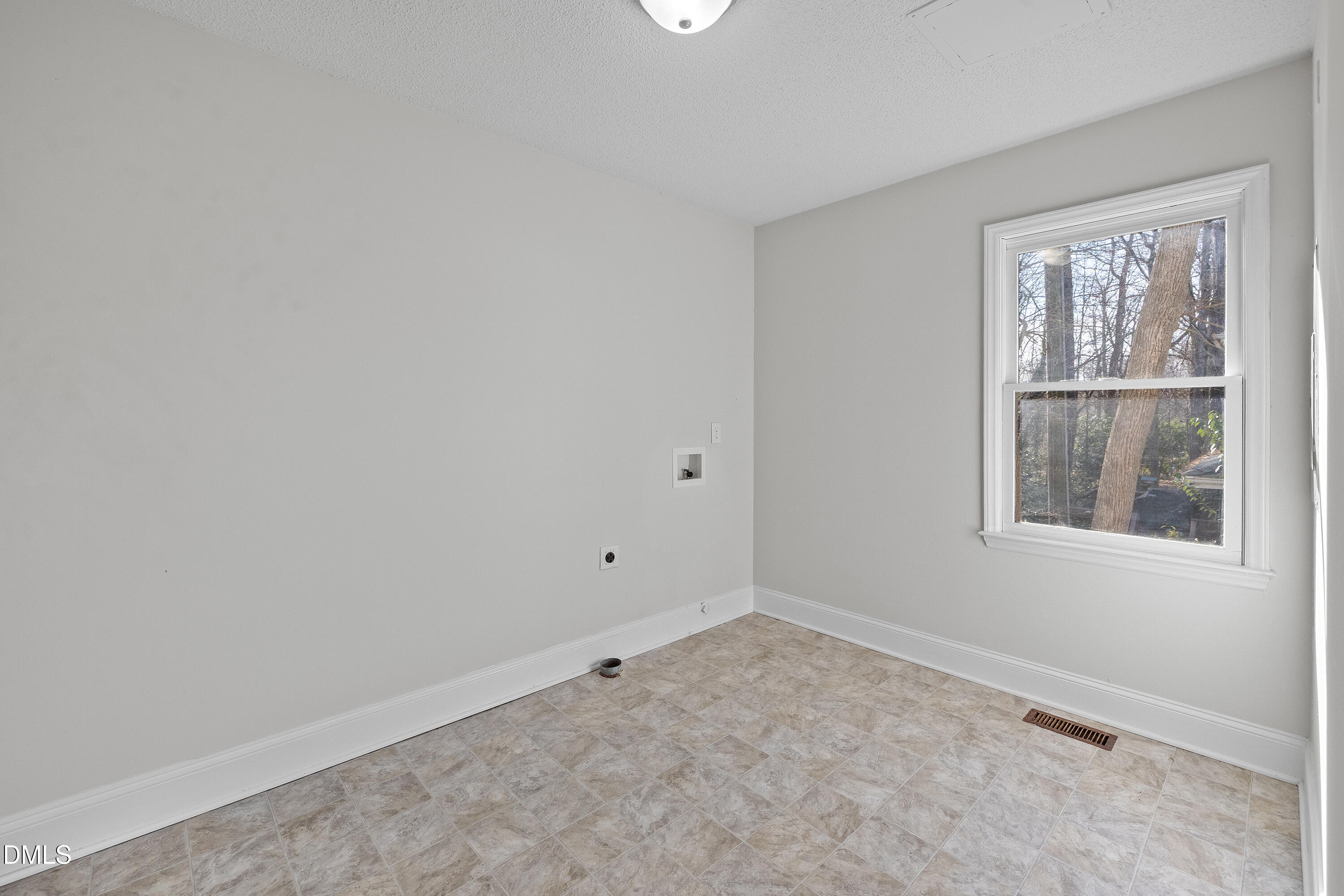 4601 Pemberton Drive Raleigh, NC 27609 - Photo 37 of 44 an empty room with a window