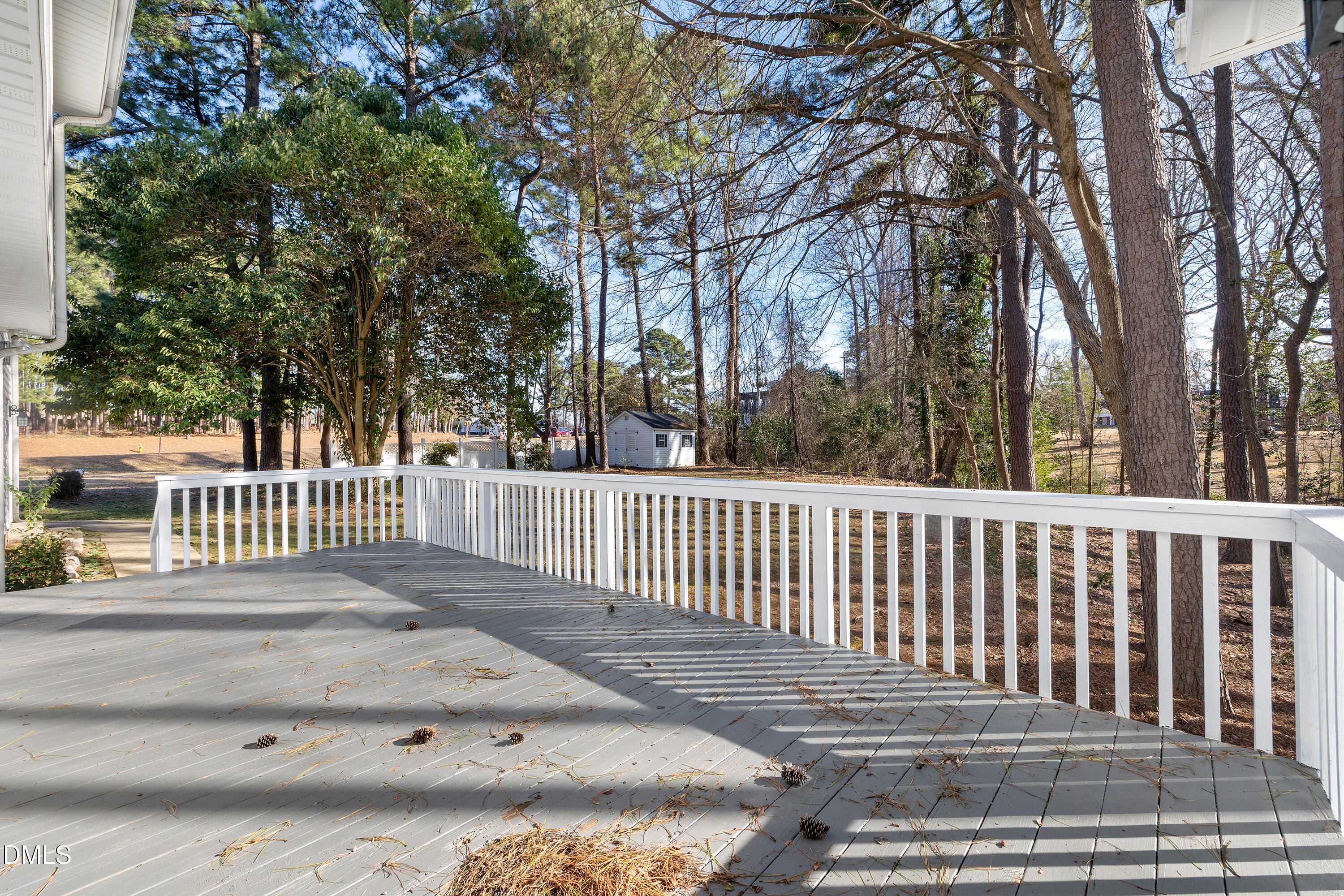4601 Pemberton Drive Raleigh, NC 27609 - Photo 42 of 44 a view of a deck with a trees