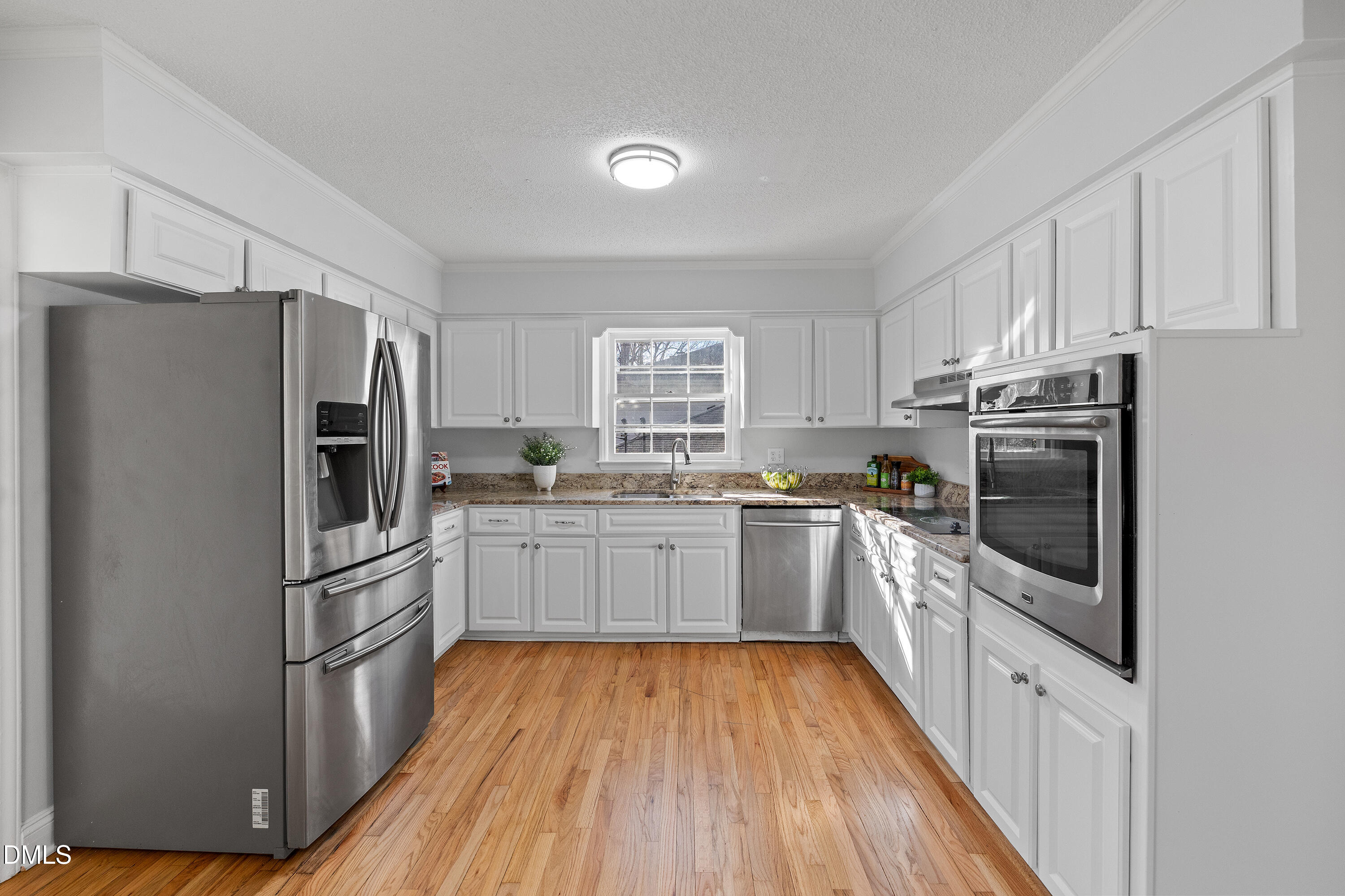 4601 Pemberton Drive Raleigh, NC 27609 - Photo 3 of 44 a kitchen with stainless steel appliances a refrigerator sink and microwave