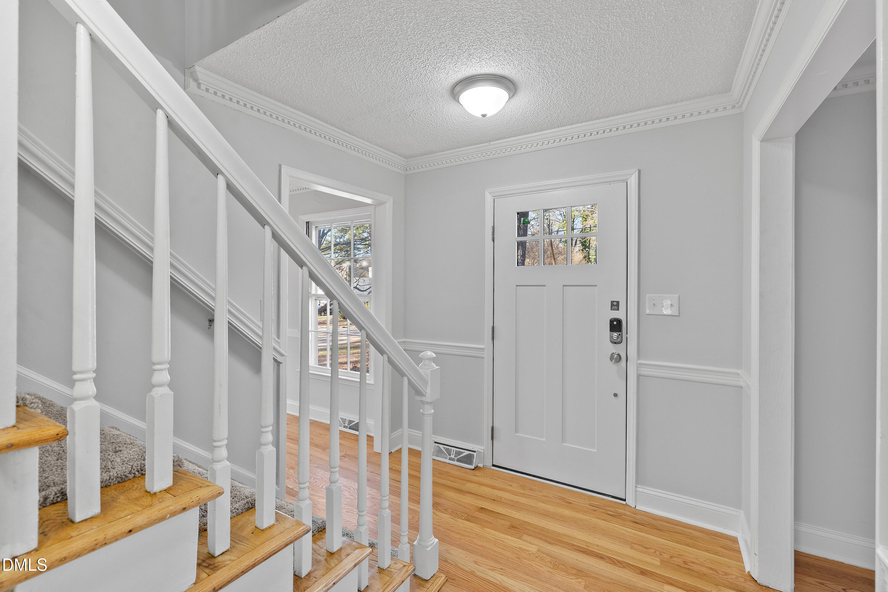 4601 Pemberton Drive Raleigh, NC 27609 - Photo 8 of 44 a view of front door with stairs