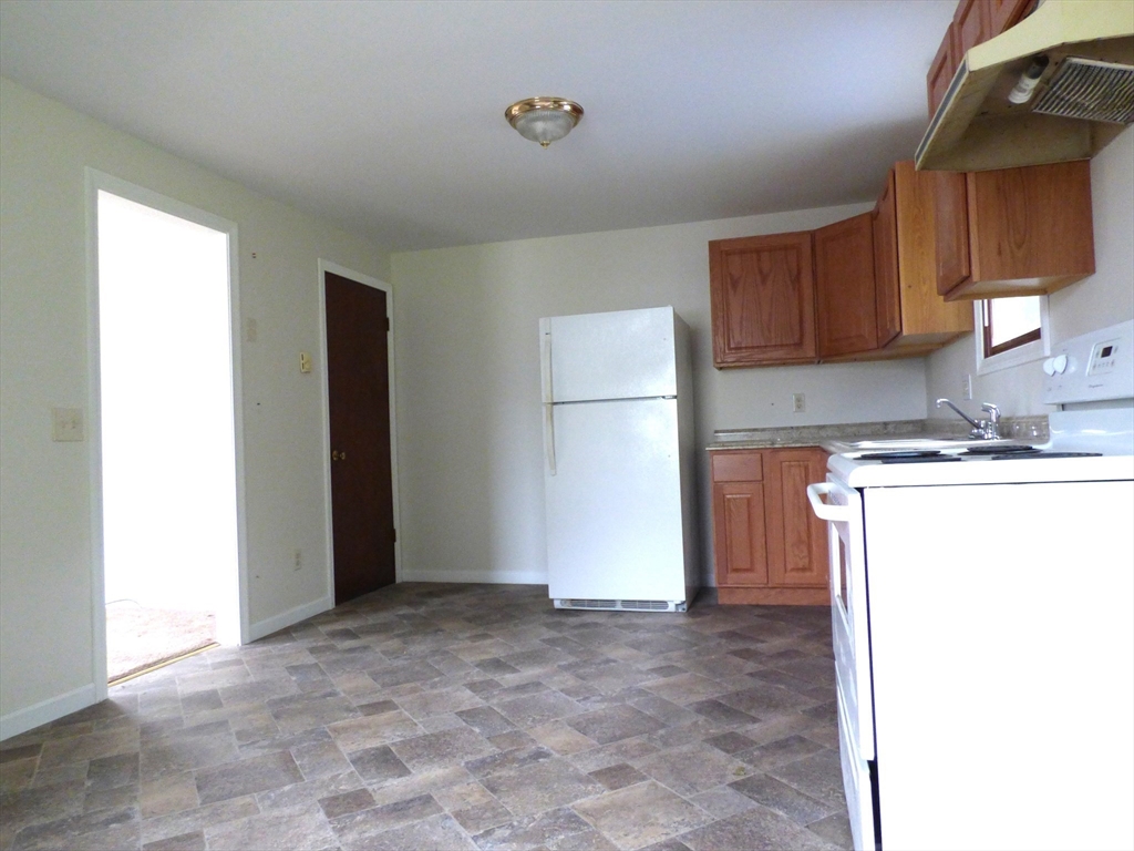 26-28 Daniel Street Springfield, MA 01151 - Photo 5 of 15 a view of kitchen with refrigerator sink and cabinets