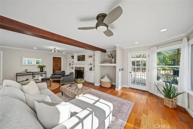 a bedroom with furniture and a large window