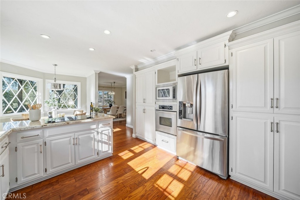 12250 San Antonio Road Atascadero, CA 93422 - Photo 15 of 46 a kitchen with stainless steel appliances a refrigerator sink and cabinets