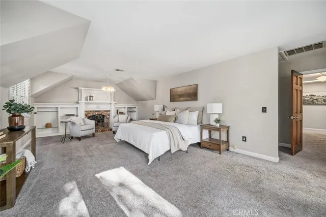 a bed room with furniture and a lamp