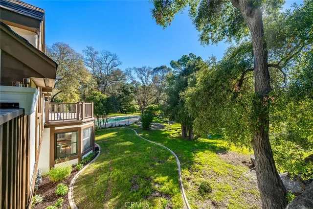a backyard of a house with lots of green space