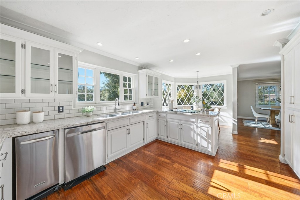 12250 San Antonio Road Atascadero, CA 93422 - Photo 3 of 46 a kitchen with granite countertop cabinets and wooden floor