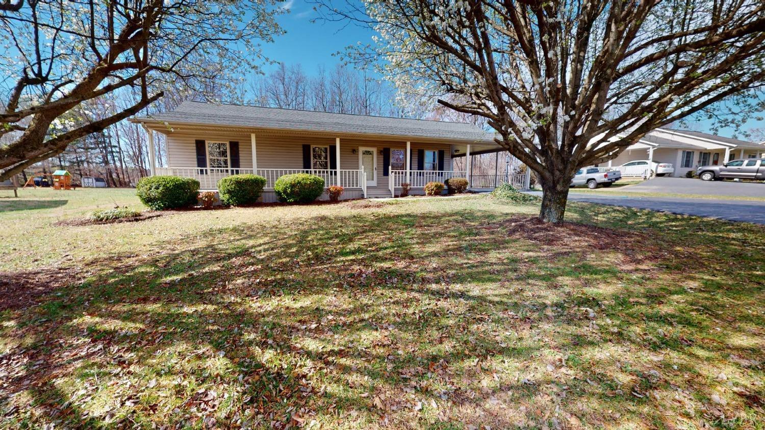 3328 Rocksprings Road Ringgold, VA 24586 - Photo 2 of 39 a front view of a house with a yard