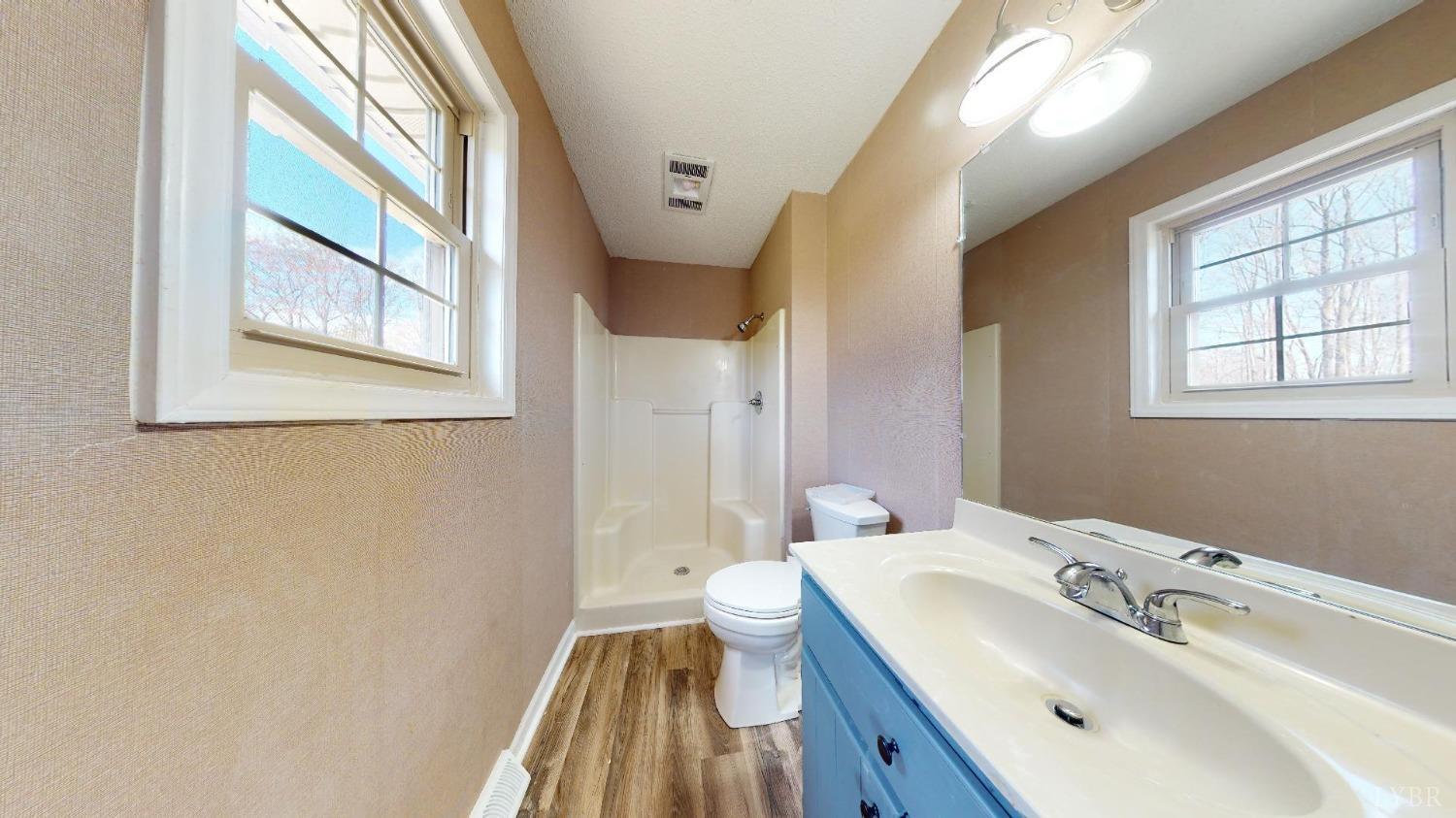 3328 Rocksprings Road Ringgold, VA 24586 - Photo 29 of 39 a bathroom with a sink and a large mirror