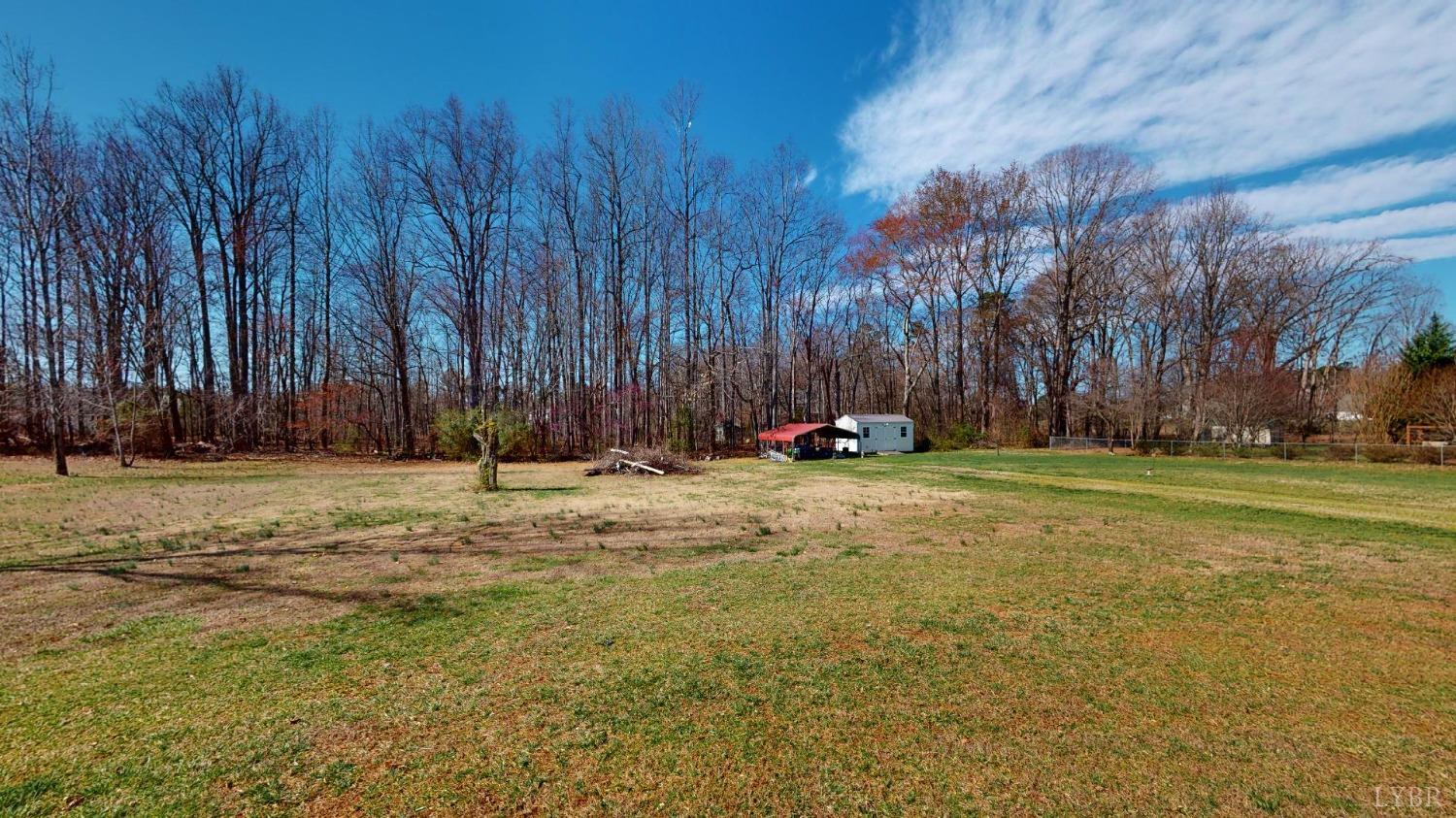 3328 Rocksprings Road Ringgold, VA 24586 - Photo 38 of 39 a backyard of a house with lots of green space