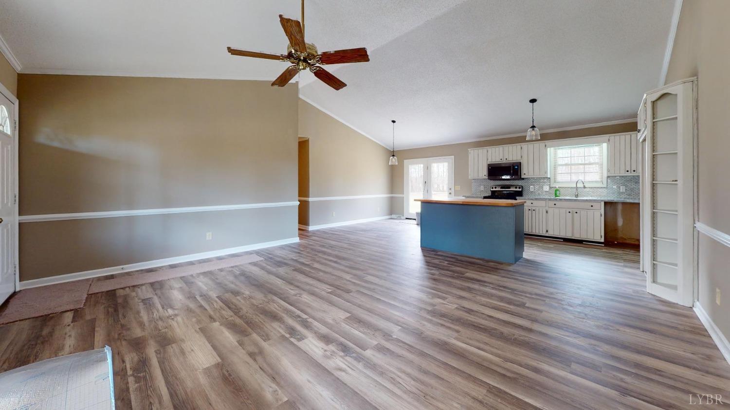 3328 Rocksprings Road Ringgold, VA 24586 - Photo 9 of 39 a view of kitchen with wooden floor and window
