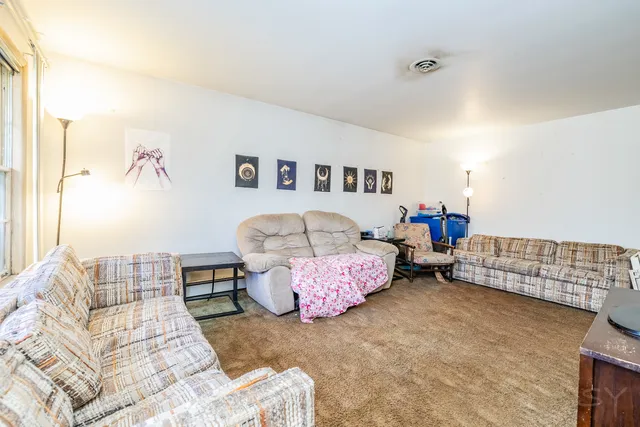 a bedroom with furniture and a couch