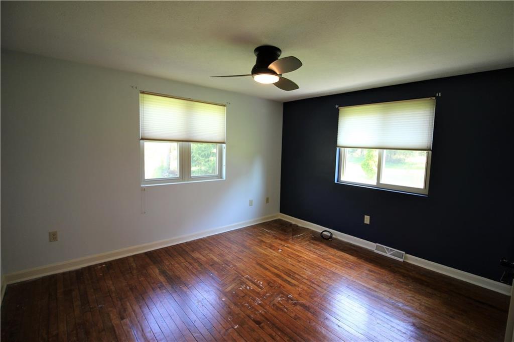 308 Georgetown Road Canonsburg, PA 15317 - Photo 11 of 24 The master bedroom with ceiling fan, blinds, double door closet and original hardwood floor.