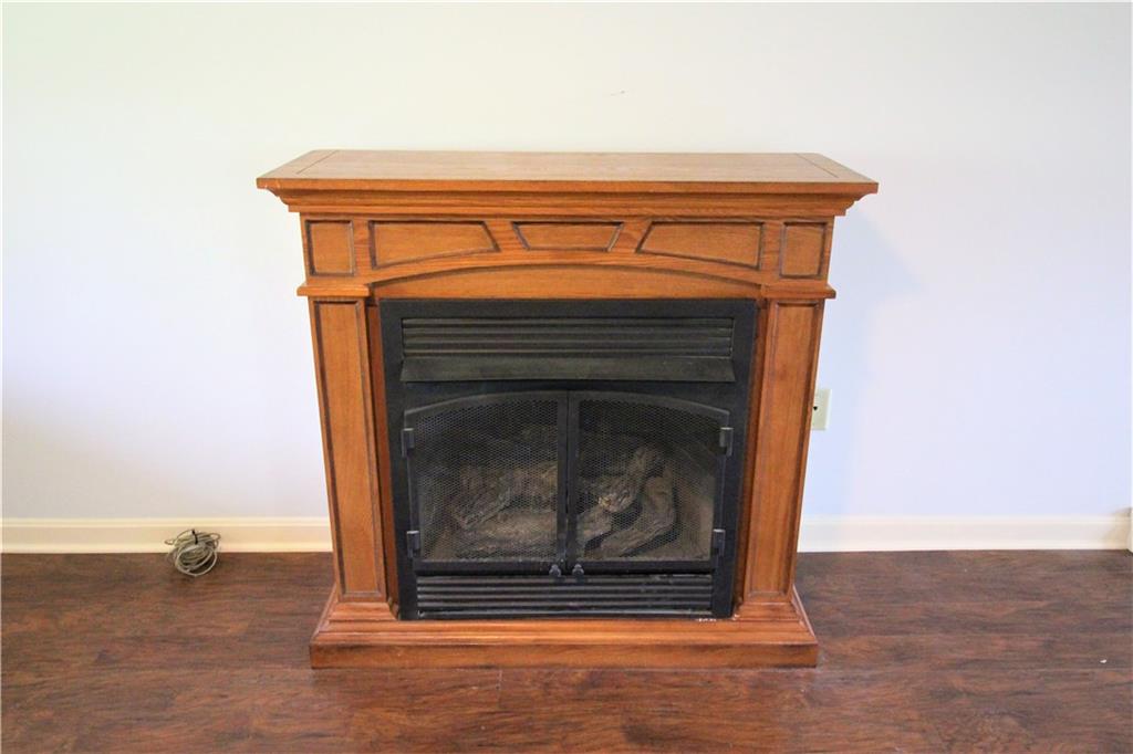 A free standing gas log fireplace to make the living room nice and cozy
