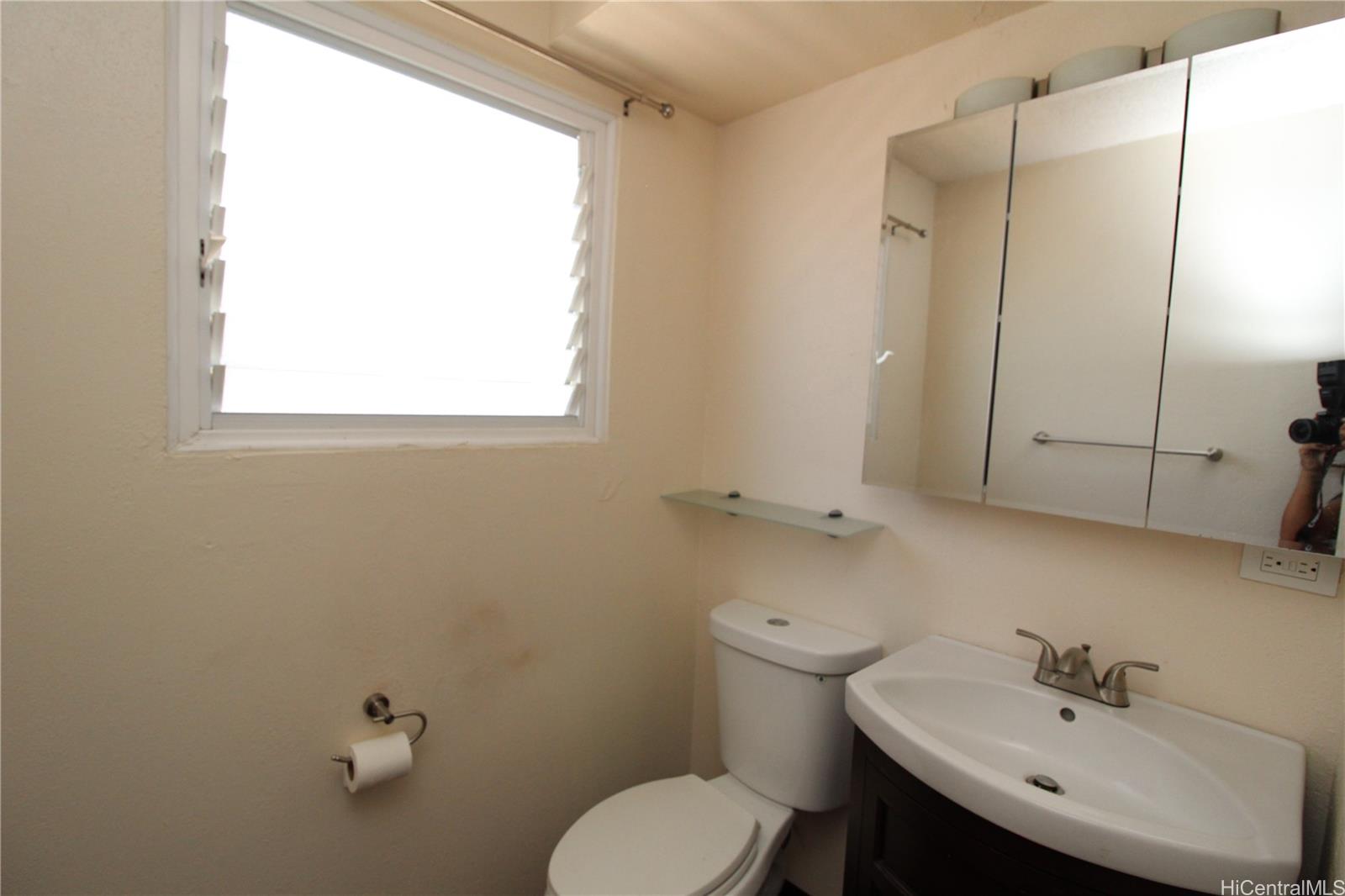 2503 Ala Wai Boulevard, Unit F Honolulu, HI 96815 - Photo 2 of 8 a bathroom with a sink toilet and shower