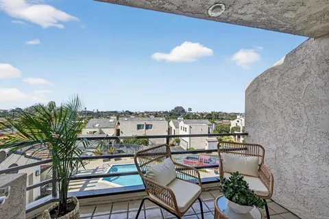 a view of a chairs and table in a terrace