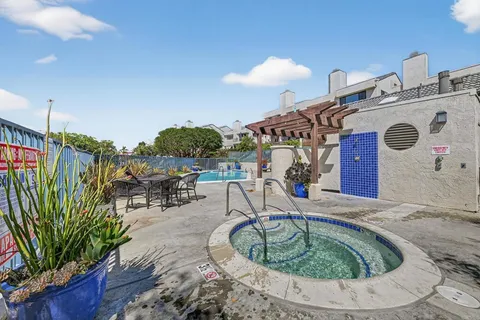 a view of a swimming pool with chairs