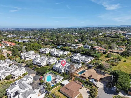 an aerial view of a city with lots of residential buildings