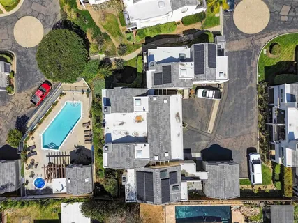 an aerial view of houses with outdoor space