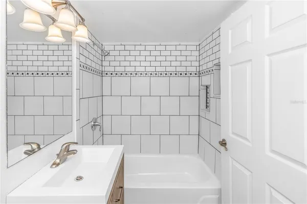 a bathroom with sink and bathtub