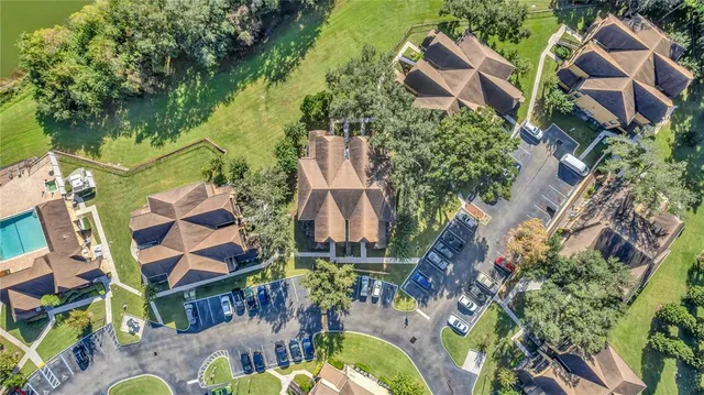 an aerial view of residential house with outdoor space and swimming pool