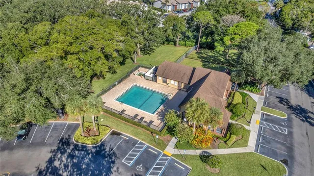 an aerial view of a house with outdoor space