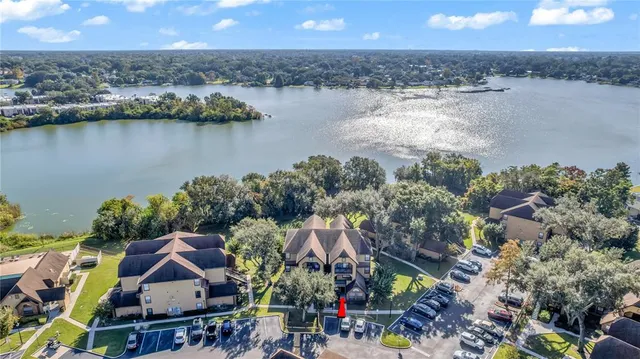 an aerial view of a house with a lake view