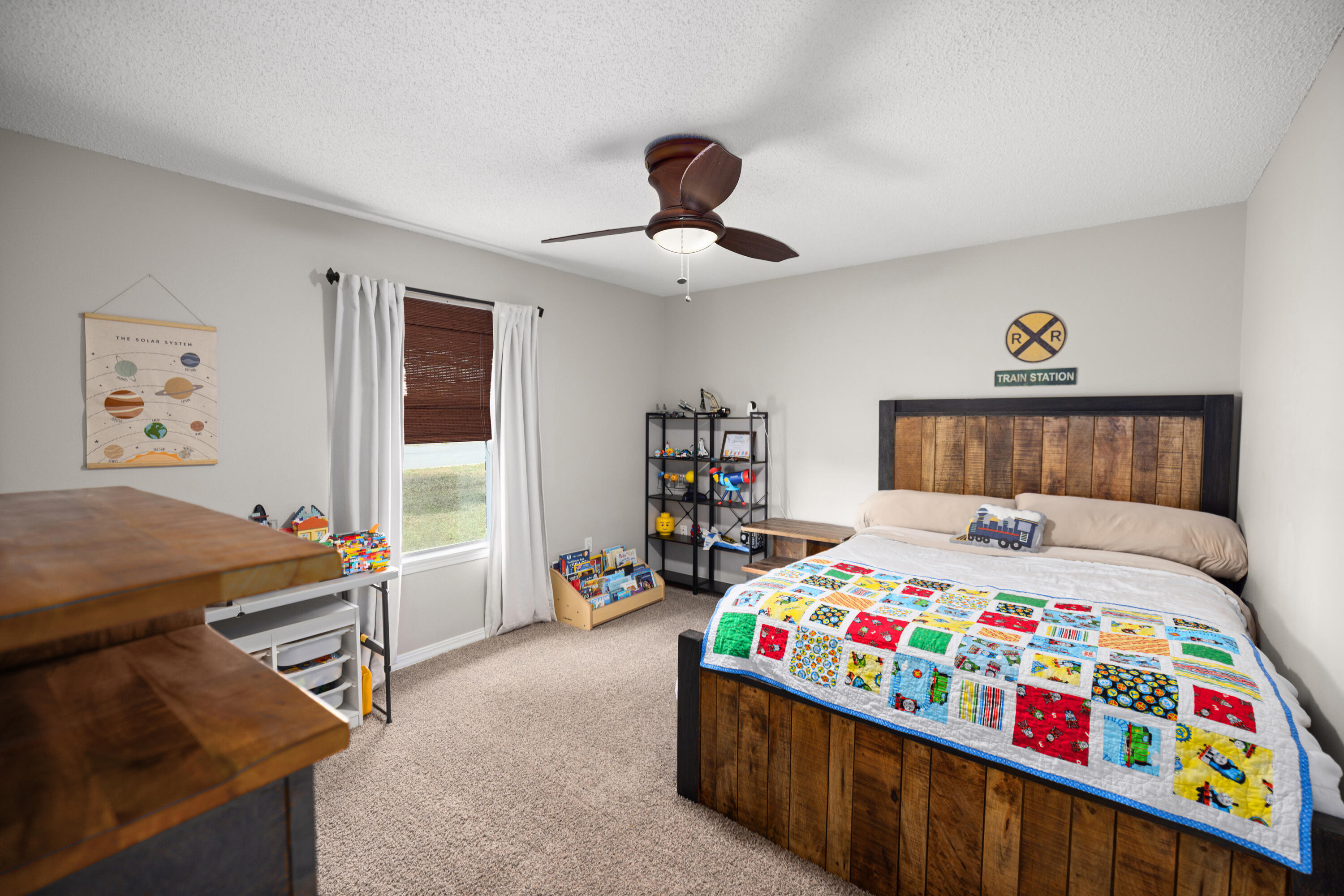 202 Limestone Circle Crestview, FL 32539 - Photo 27 of 49 a bedroom with a bed and a dresser in it