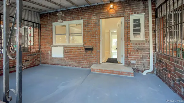 a view of an empty room with a fireplace