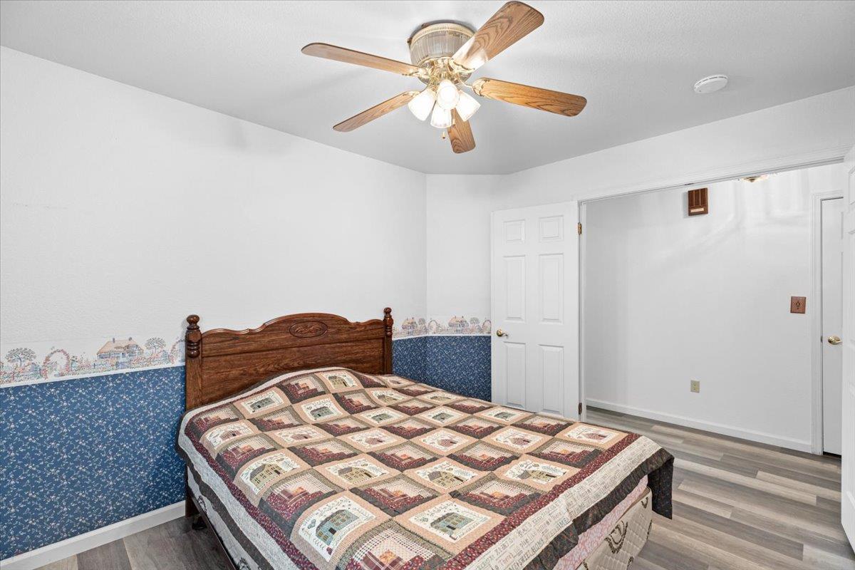 3005 Willetts Way Ceres, CA 95307 - Photo 13 of 29 a bedroom with a bed and a chandelier