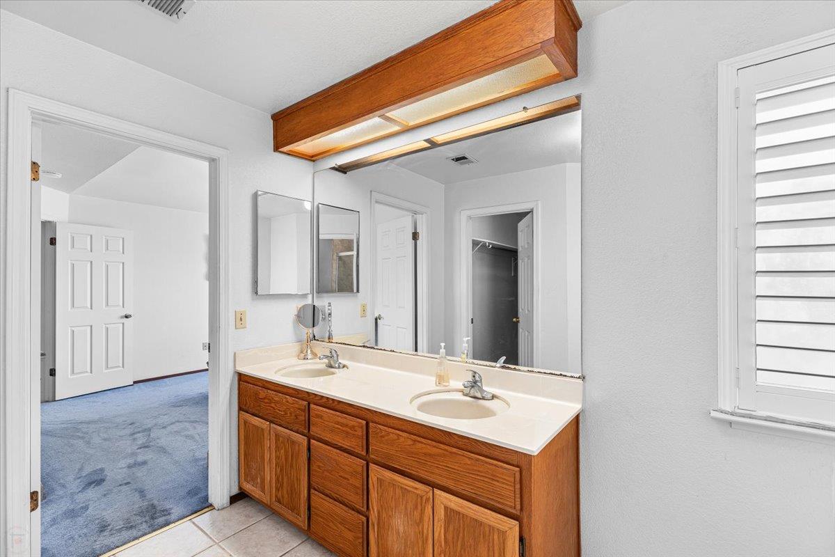 3005 Willetts Way Ceres, CA 95307 - Photo 20 of 29 a bathroom with a sink and a mirror