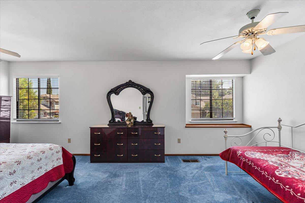 3005 Willetts Way Ceres, CA 95307 - Photo 22 of 29 a bedroom with a bed and a dresser